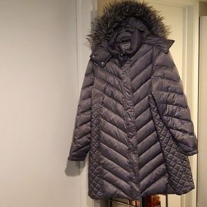 Winter hooded medium length snap & zip quilted parka with 2 exterior pockets. 2X